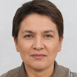 Joyful white adult female with short  brown hair and brown eyes