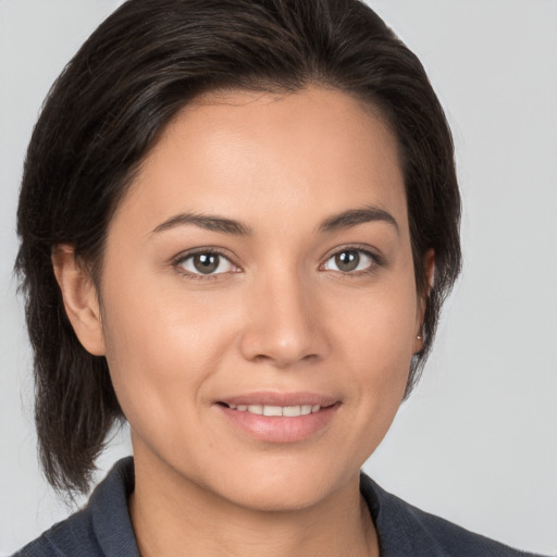 Joyful white young-adult female with medium  brown hair and brown eyes