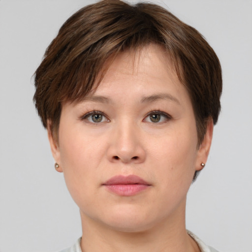 Neutral white young-adult female with short  brown hair and brown eyes