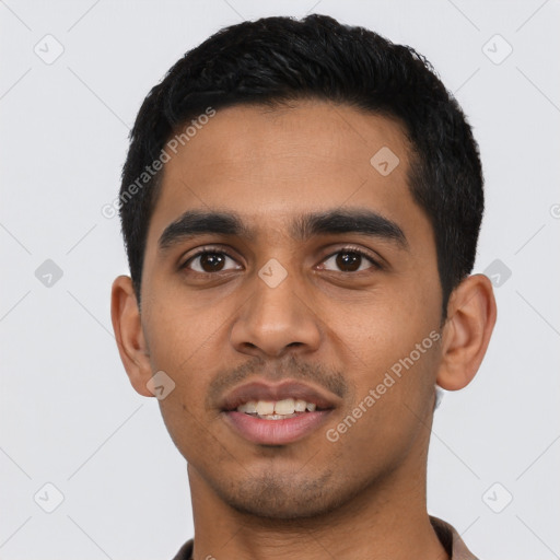Joyful latino young-adult male with short  black hair and brown eyes