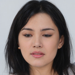 Joyful asian young-adult female with long  black hair and brown eyes