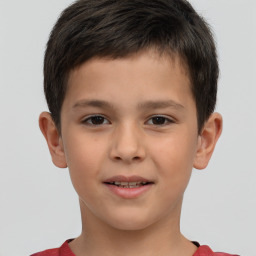 Joyful white child male with short  brown hair and brown eyes