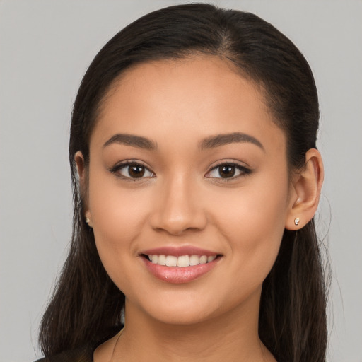 Joyful white young-adult female with long  brown hair and brown eyes