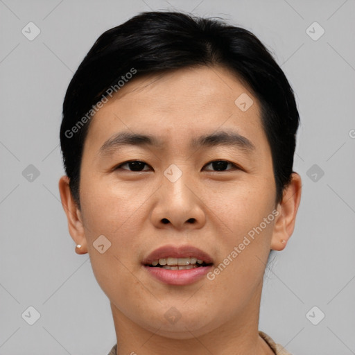 Joyful asian young-adult male with short  black hair and brown eyes