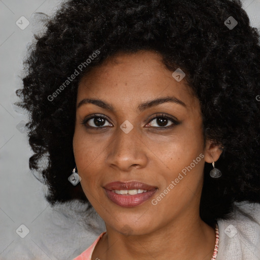 Joyful black young-adult female with long  black hair and brown eyes