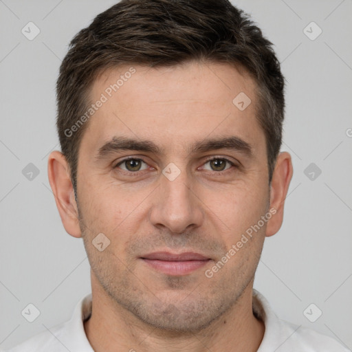 Joyful white young-adult male with short  brown hair and brown eyes