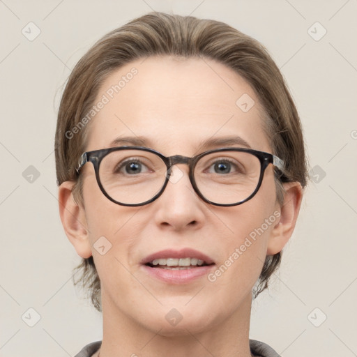 Joyful white adult female with medium  brown hair and grey eyes