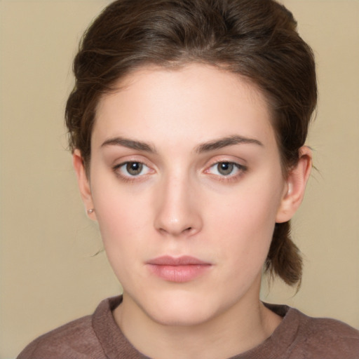 Neutral white young-adult female with short  brown hair and brown eyes