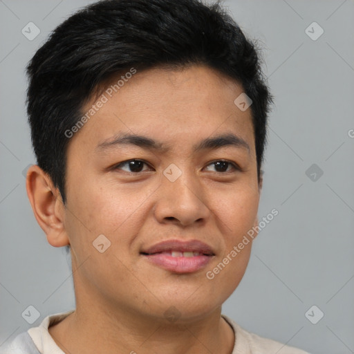 Joyful asian young-adult male with short  brown hair and brown eyes