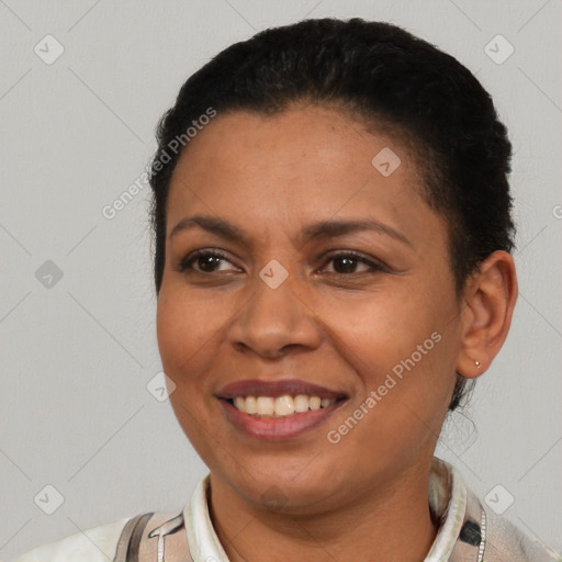 Joyful latino young-adult female with short  brown hair and brown eyes