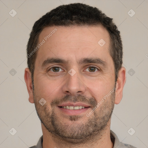 Joyful white adult male with short  brown hair and brown eyes