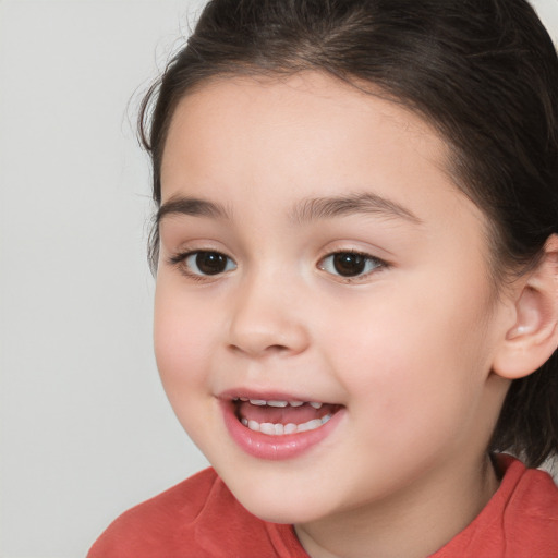 Joyful white child female with long  brown hair and brown eyes