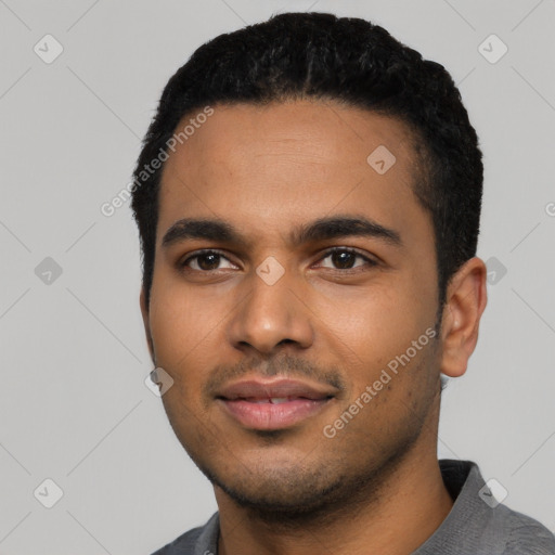 Joyful latino young-adult male with short  black hair and brown eyes