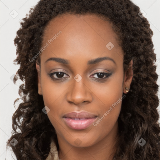 Joyful black young-adult female with long  brown hair and brown eyes