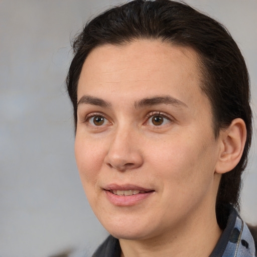 Joyful white adult female with medium  brown hair and brown eyes