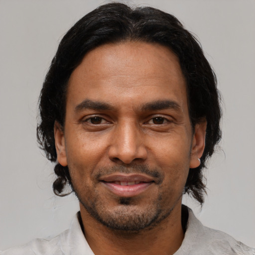 Joyful asian adult male with short  black hair and brown eyes