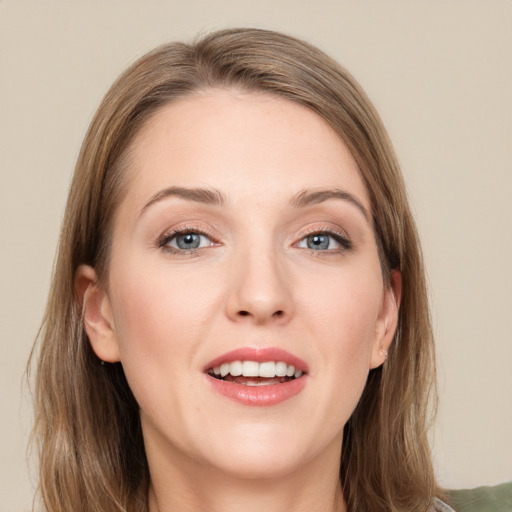 Joyful white young-adult female with medium  brown hair and green eyes