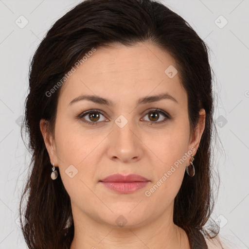 Joyful white young-adult female with long  brown hair and brown eyes