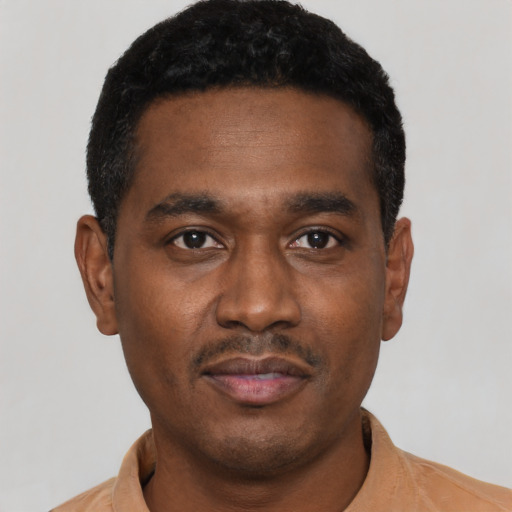 Neutral black young-adult male with short  black hair and brown eyes