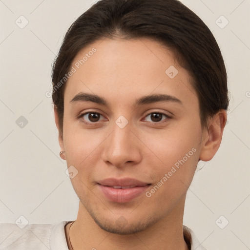 Joyful white young-adult female with short  brown hair and brown eyes