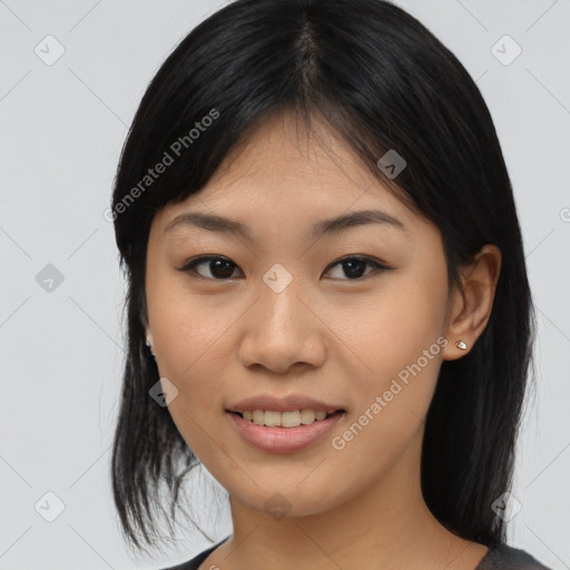 Joyful asian young-adult female with medium  black hair and brown eyes