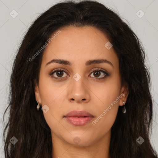 Joyful latino young-adult female with long  brown hair and brown eyes