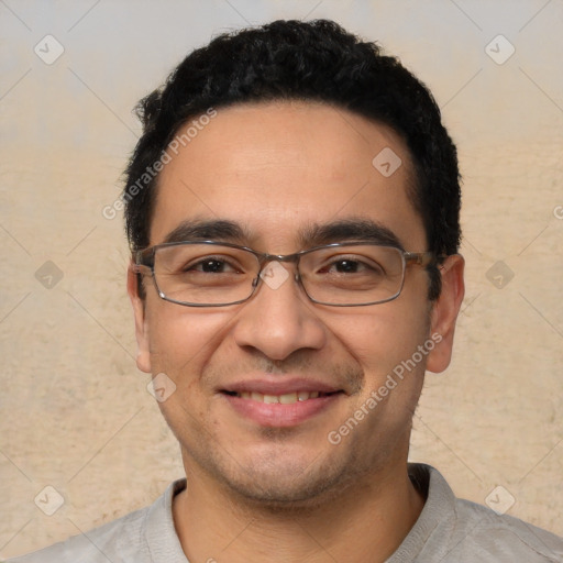 Joyful latino young-adult male with short  black hair and brown eyes