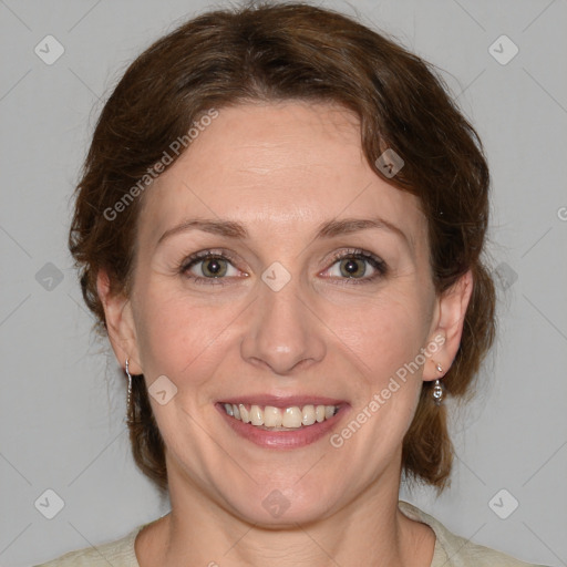 Joyful white adult female with medium  brown hair and blue eyes