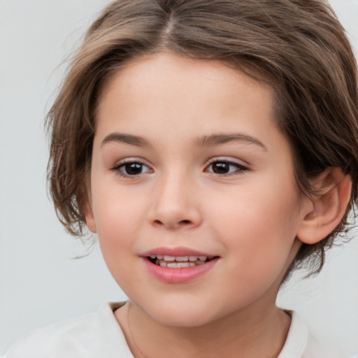 Joyful white child female with medium  brown hair and brown eyes