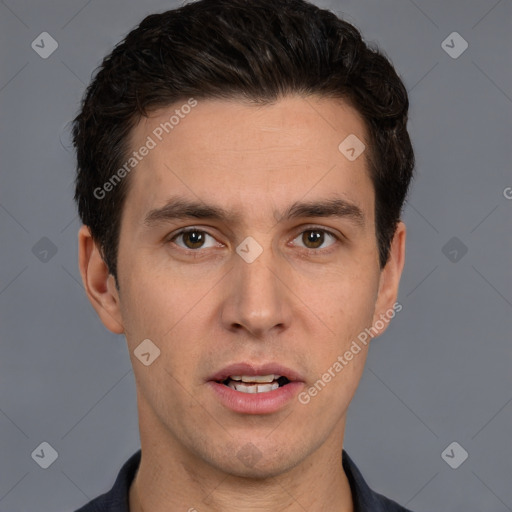 Joyful white adult male with short  brown hair and brown eyes