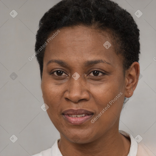 Joyful black adult female with short  brown hair and brown eyes