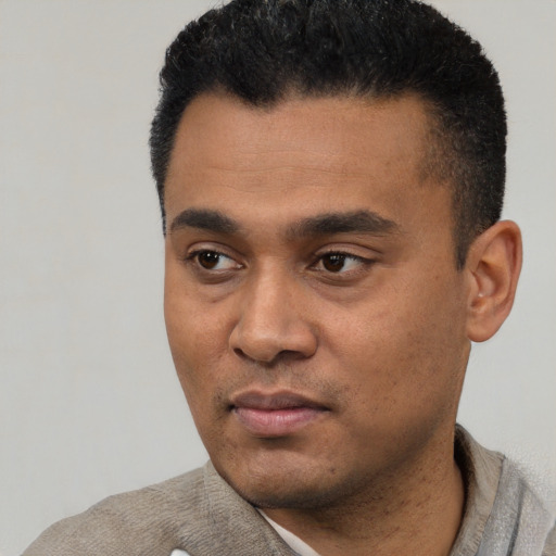 Neutral latino young-adult male with short  black hair and brown eyes