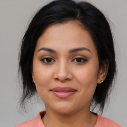 Joyful asian young-adult female with medium  brown hair and brown eyes