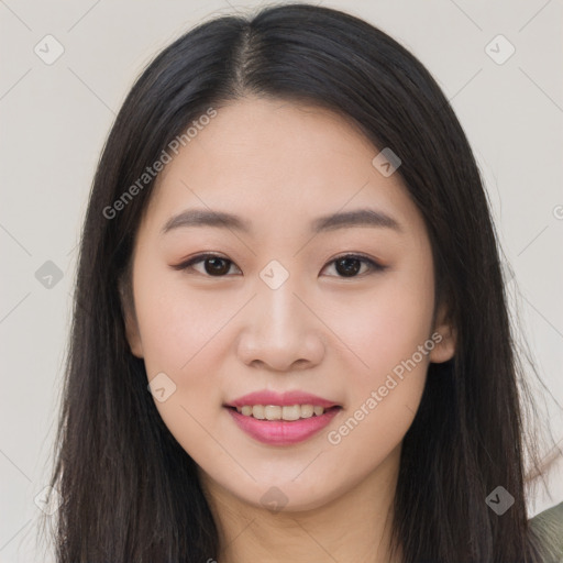 Joyful asian young-adult female with long  brown hair and brown eyes