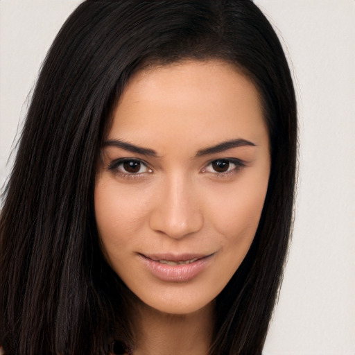 Joyful asian young-adult female with long  brown hair and brown eyes