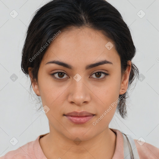 Joyful latino young-adult female with medium  brown hair and brown eyes