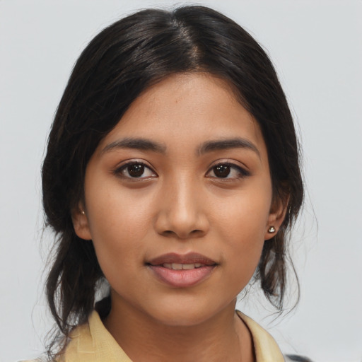 Joyful asian young-adult female with medium  brown hair and brown eyes