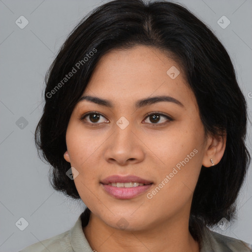 Joyful asian young-adult female with medium  black hair and brown eyes