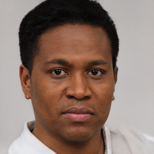 Neutral black young-adult male with short  black hair and brown eyes