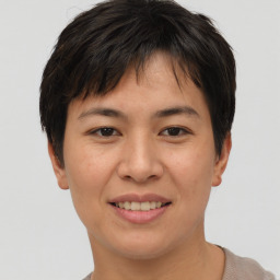 Joyful asian young-adult female with short  brown hair and brown eyes