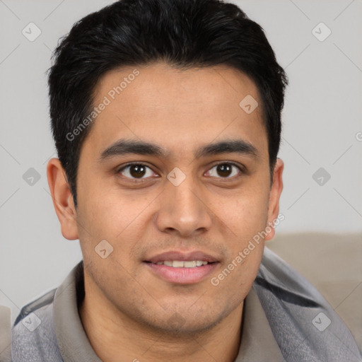 Joyful latino young-adult male with short  brown hair and brown eyes