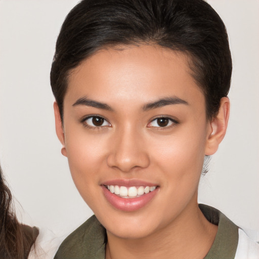 Joyful white young-adult female with medium  brown hair and brown eyes