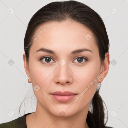 Joyful white young-adult female with long  brown hair and brown eyes