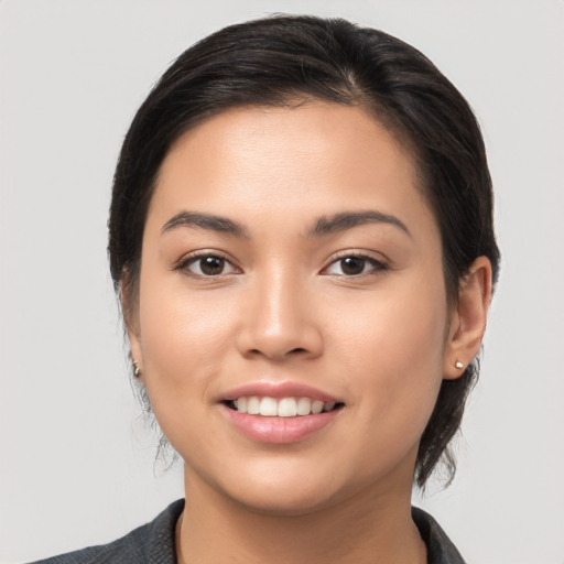 Joyful white young-adult female with medium  brown hair and brown eyes