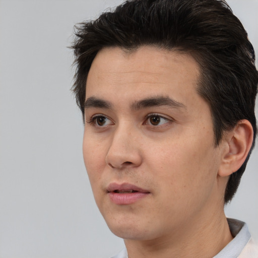 Neutral white adult male with short  black hair and brown eyes