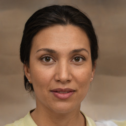 Joyful white adult female with short  brown hair and brown eyes