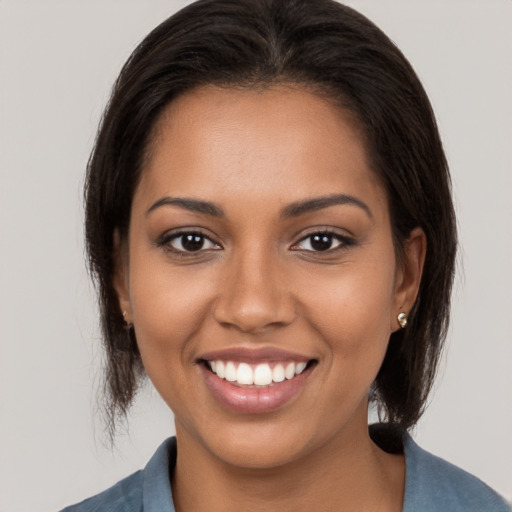 Joyful white young-adult female with medium  brown hair and brown eyes