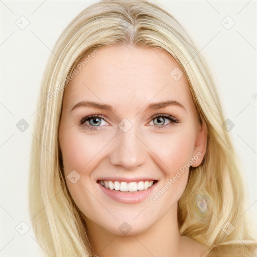 Joyful white young-adult female with long  brown hair and blue eyes