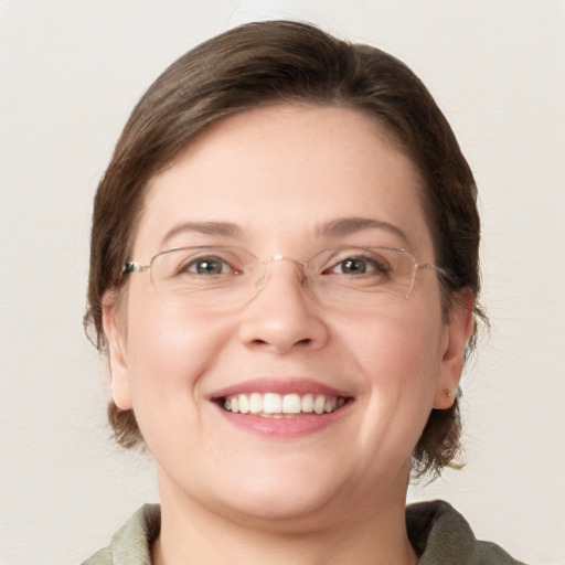 Joyful white young-adult female with medium  brown hair and blue eyes