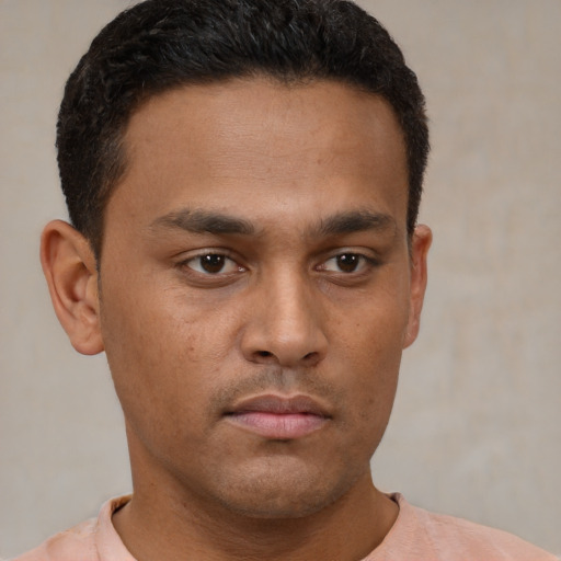 Neutral latino young-adult male with short  brown hair and brown eyes